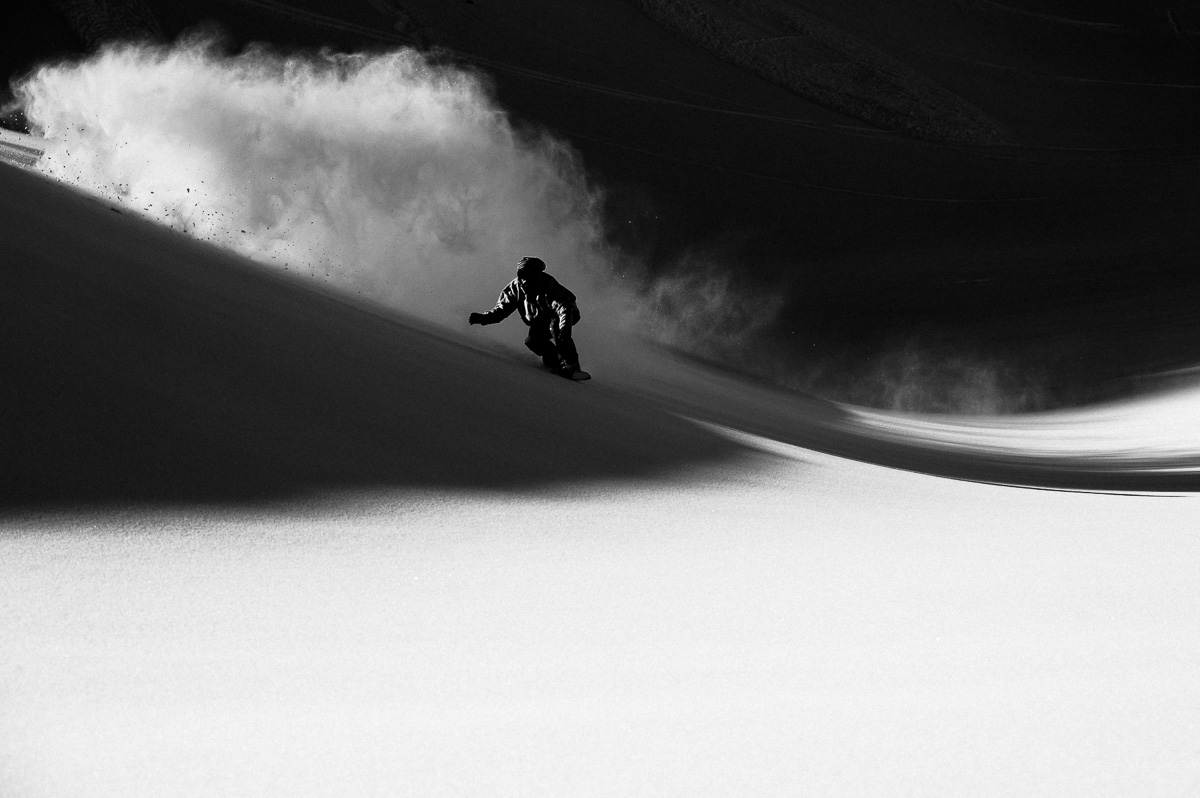 Wyatt Caldwell slashes through the day into the night in the backcountry.