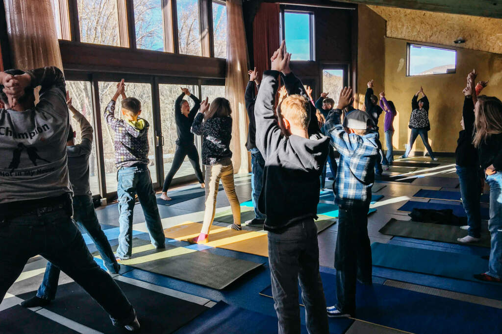  Kids learning with yoga